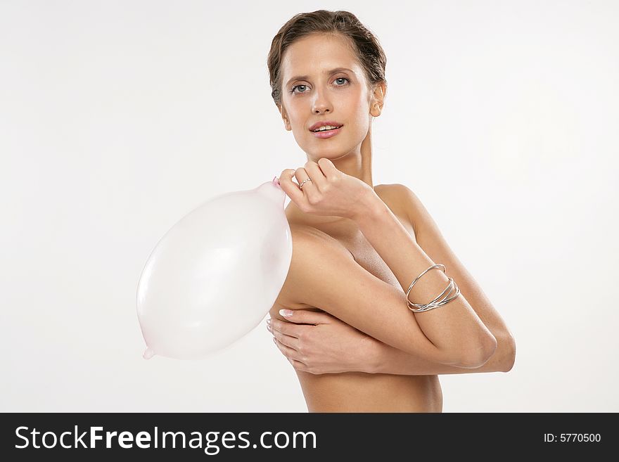 Naked women using condoms