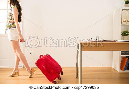 Asian girl carrying suitcase