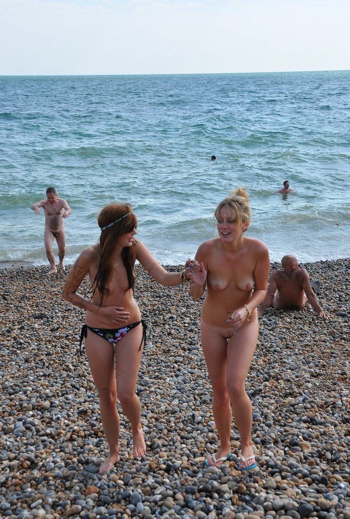 Group teens nude on beach