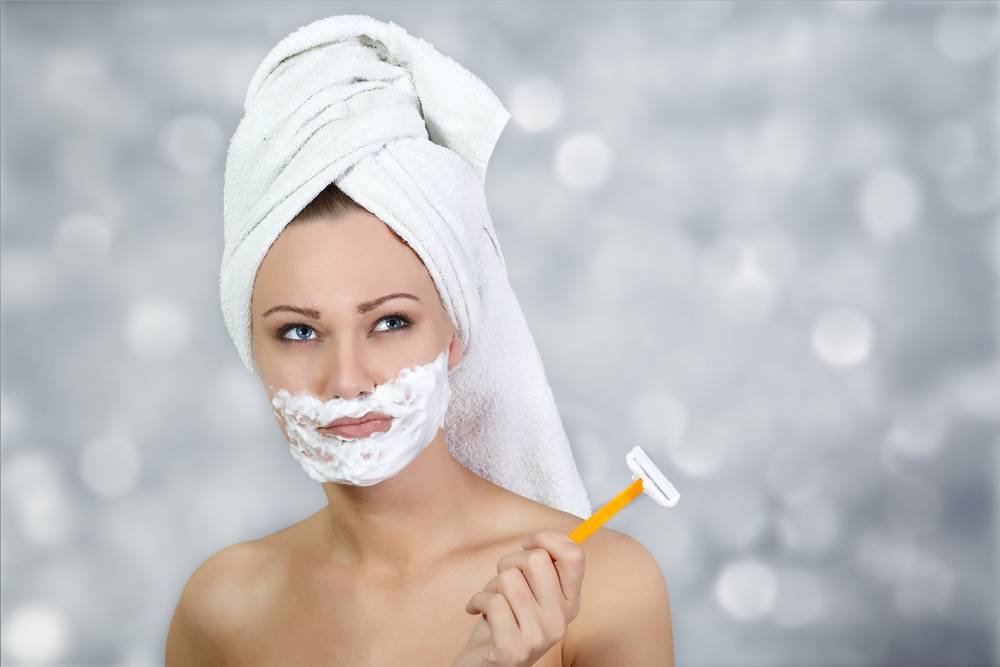 Facial hair shaving woman